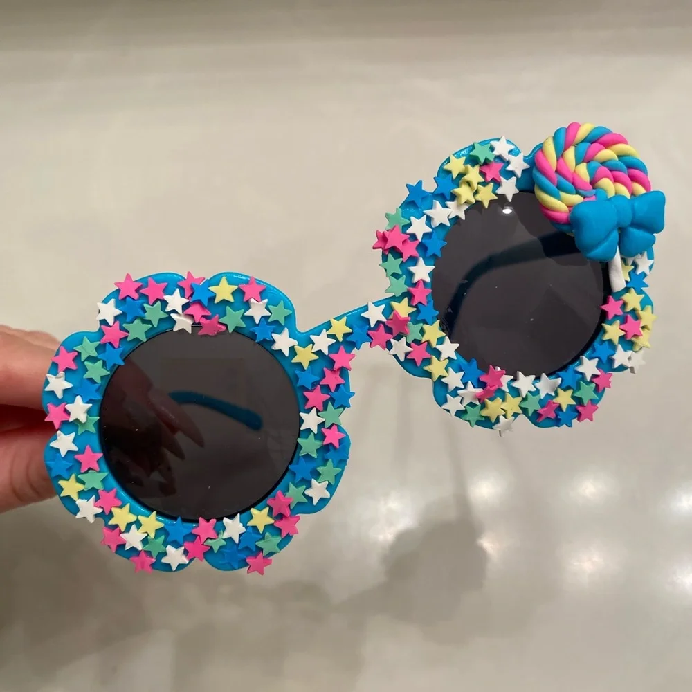 Girls electric blue flower shaped sunglasses